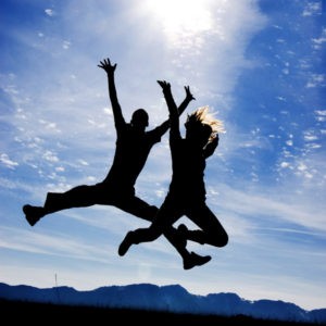 Happy people jumping